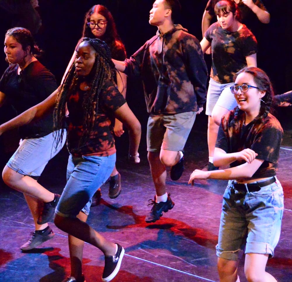 teenage kids dancing on stage