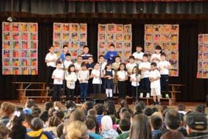 kids on stage at school