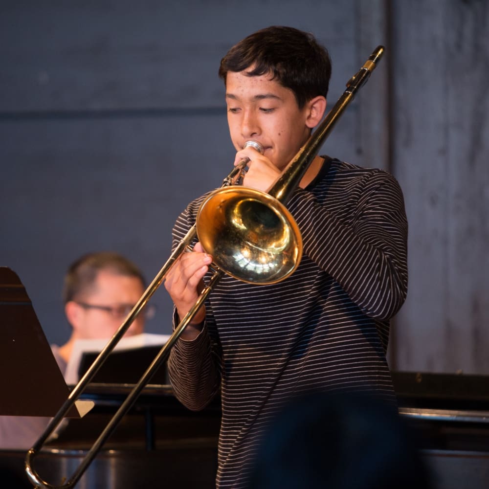 kid playing trumpet